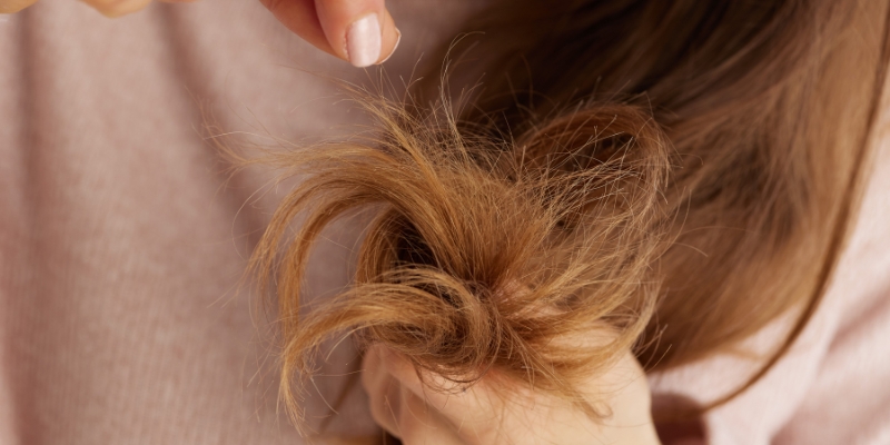 Frizzy, dry hair close-up. Anti-frizz hair care concept. Dott. Solari anti-crespo for smooth, manageable hair.